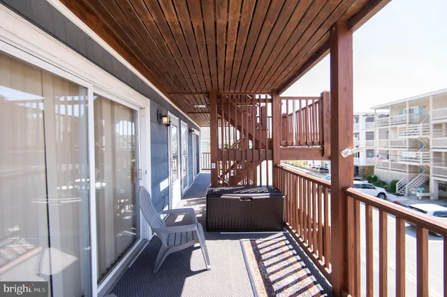a view of a balcony with chairs