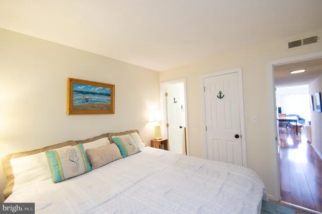 a bed room with a bed and a painting