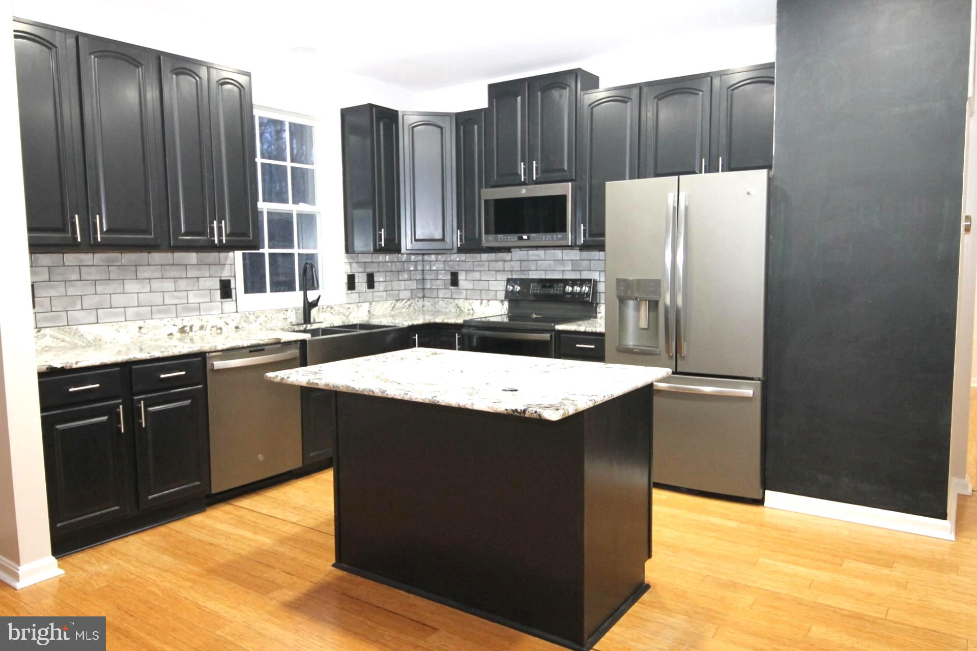 4695 Sands Road Harwood, MD 20776 - Photo 8 of 49 Sleek modern kitchen with island charm.