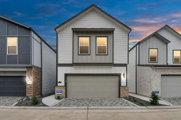 a front view of a house with yard