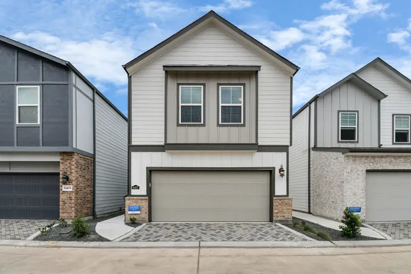 a front view of a house with yard