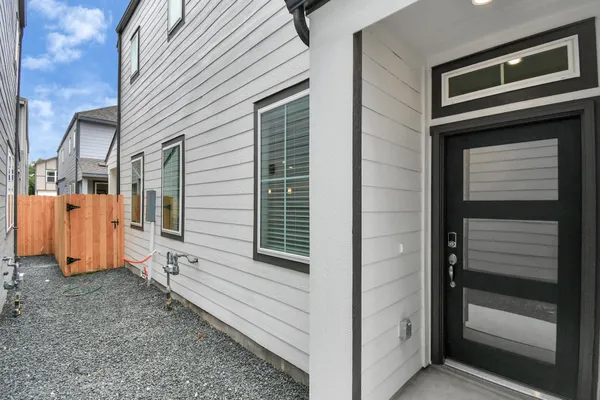 a view of a house with car parked front door