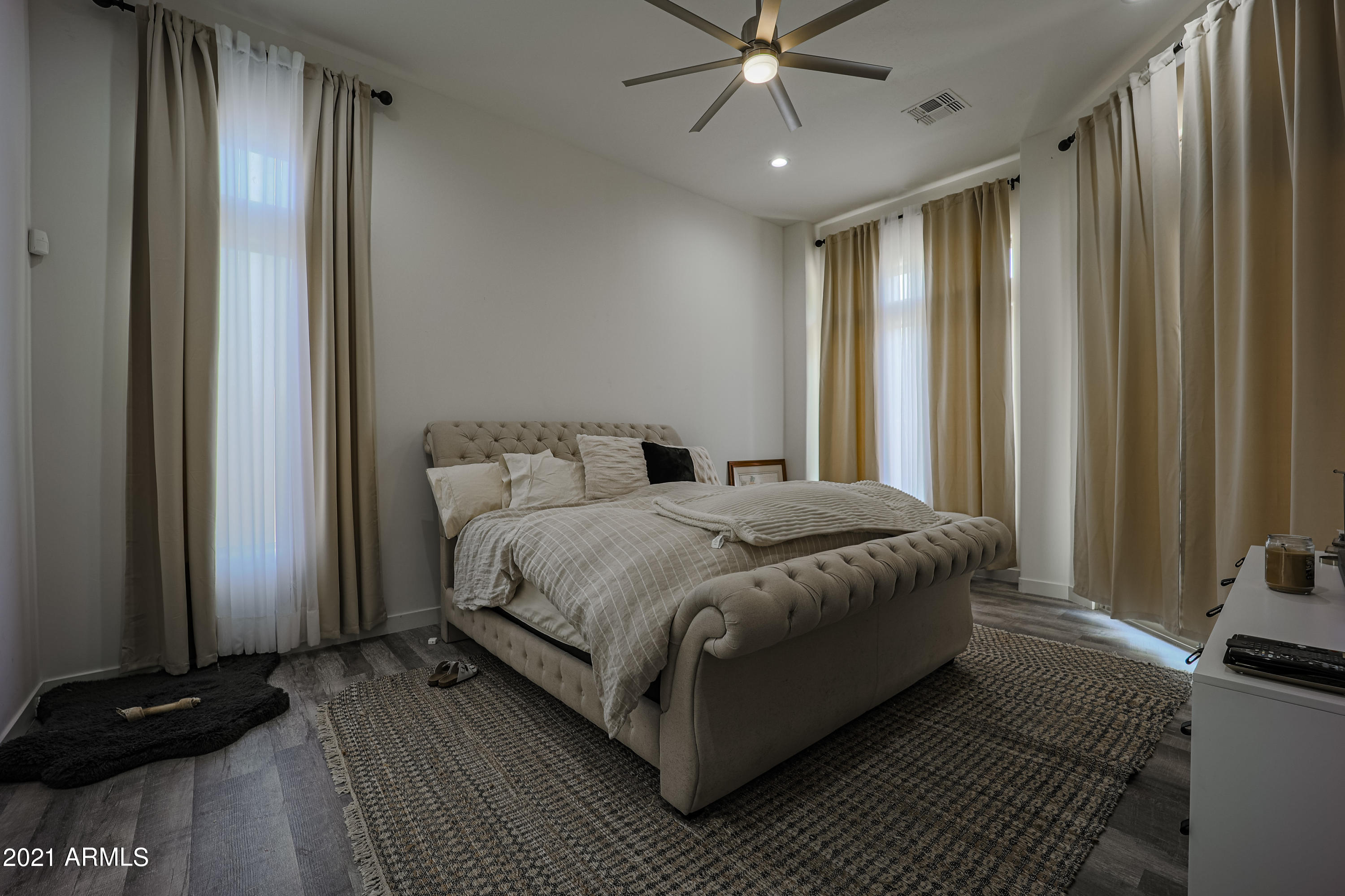 8136 East Beardsley Road Scottsdale, AZ 85255 - Photo 15 of 38 a spacious bedroom with a bed and a mirror