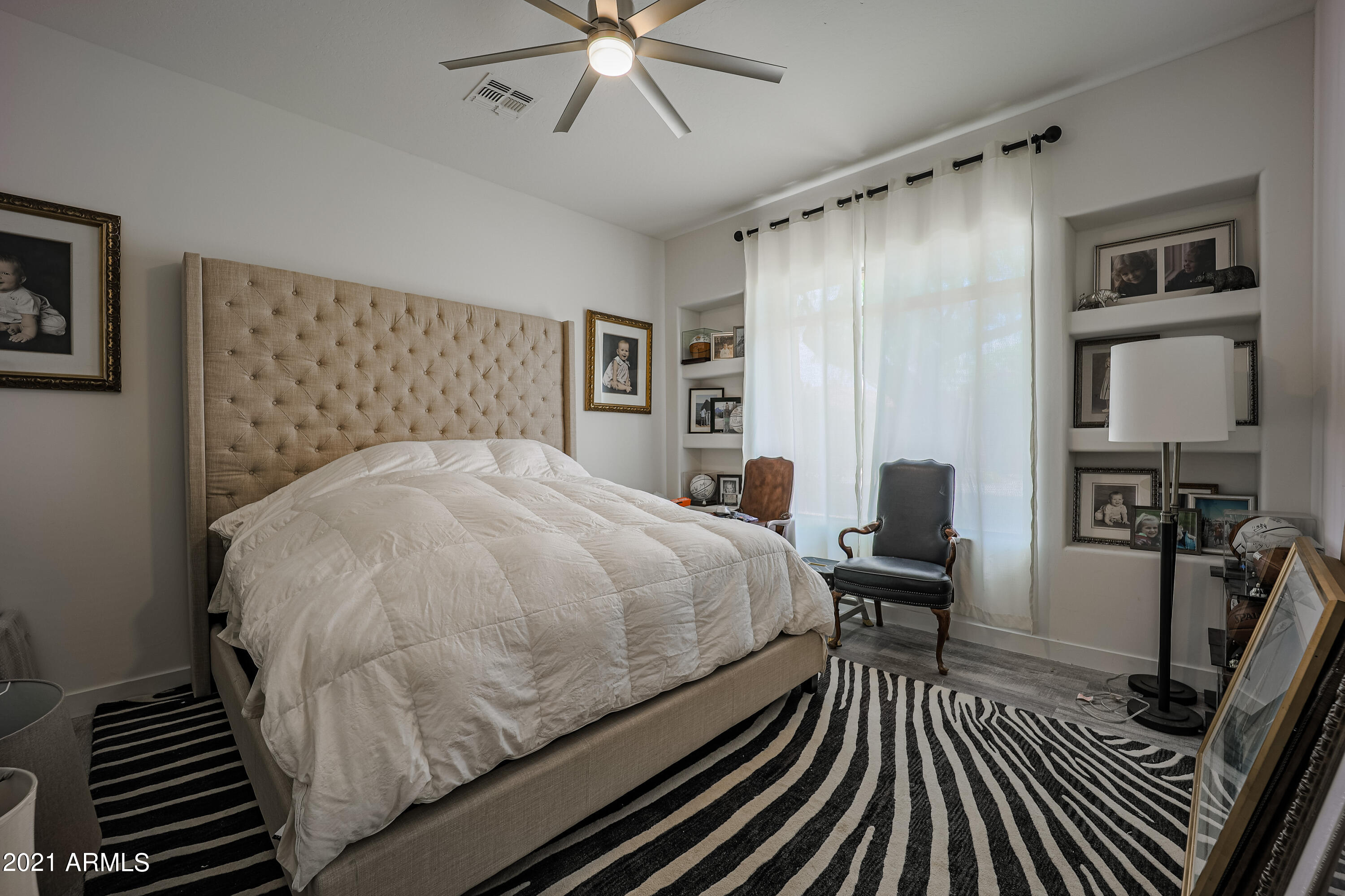 8136 East Beardsley Road Scottsdale, AZ 85255 - Photo 20 of 38 a bed sitting in a bedroom next to a window
