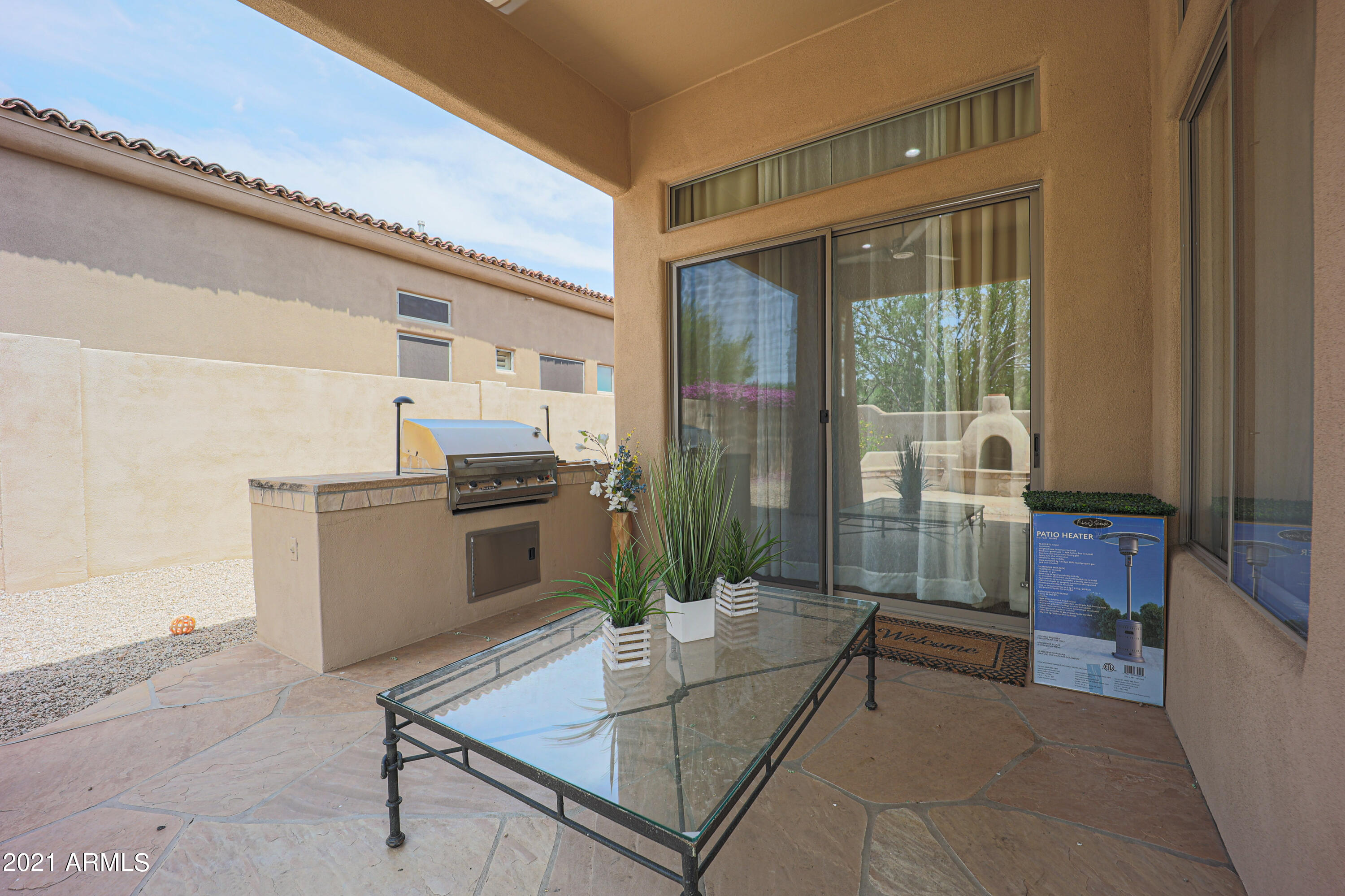 8136 East Beardsley Road Scottsdale, AZ 85255 - Photo 26 of 38 a living room with granite countertop furniture and a fireplace