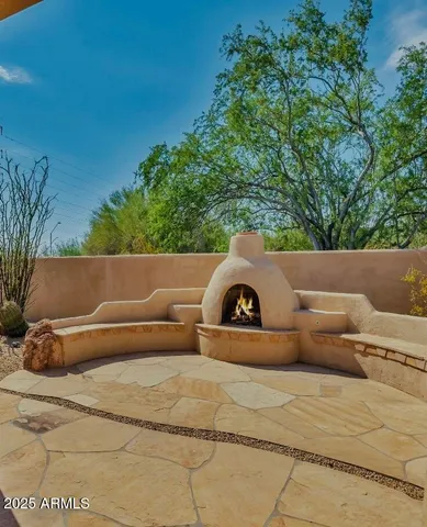 a view of fountain and a big yard