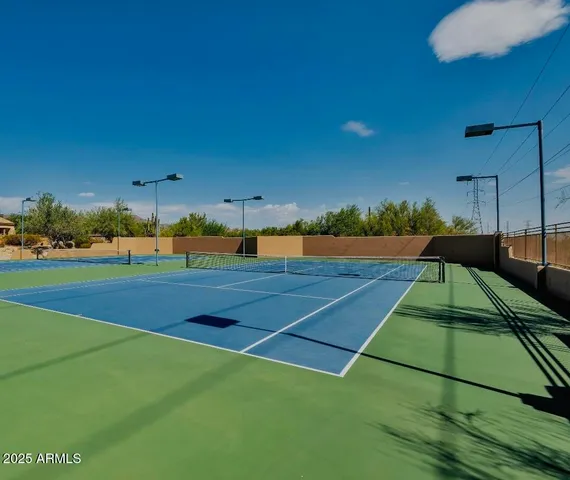 a view of an outdoor space and tennis court