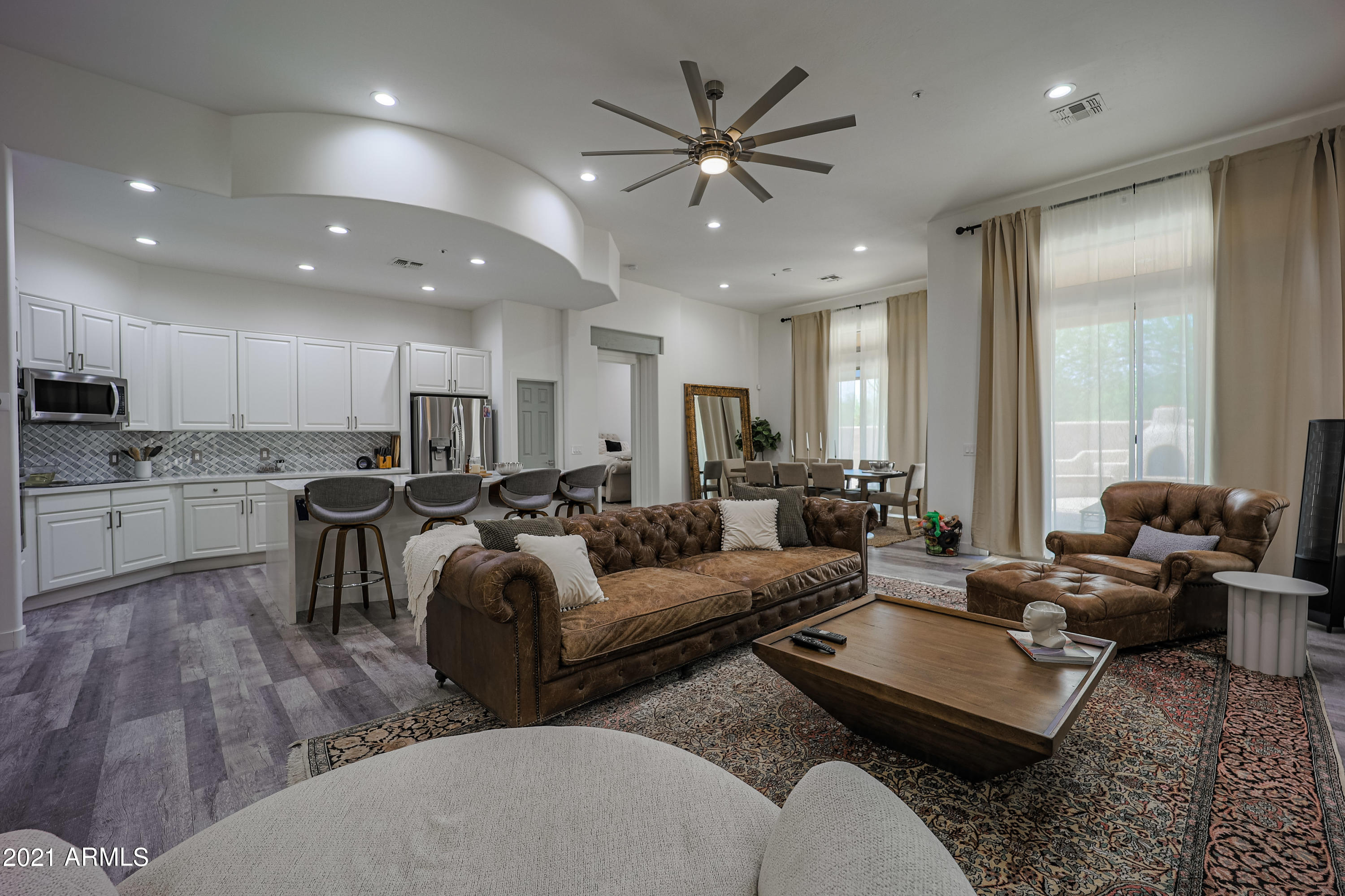 8136 East Beardsley Road Scottsdale, AZ 85255 - Photo 4 of 38 a living room with furniture kitchen and a large window