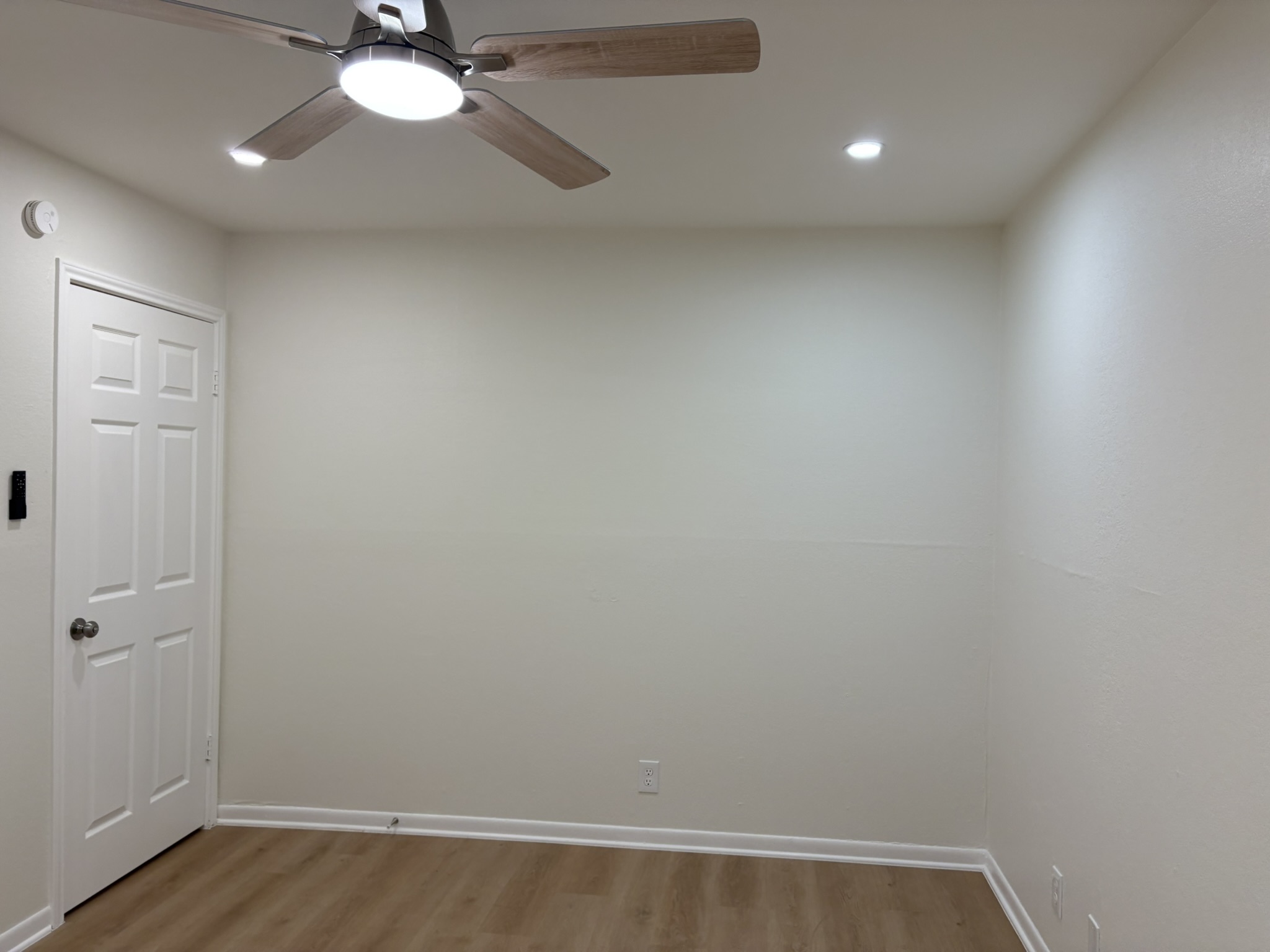 6009 Shadow Valley Cove, Unit A Austin, TX 78731 - Photo 12 of 24 Empty room featuring wood finished floors, a ceiling fan, and recessed lighting