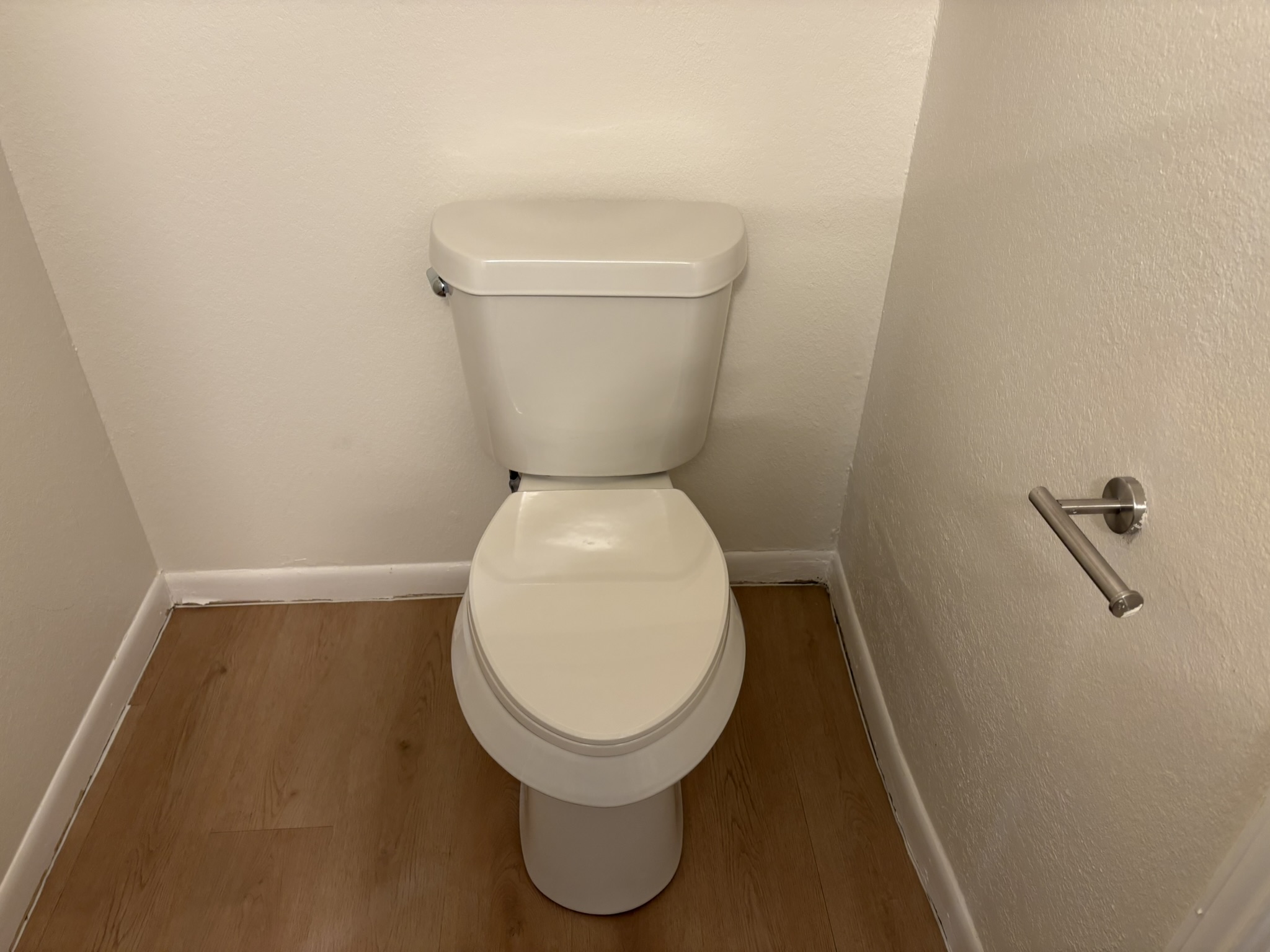 6009 Shadow Valley Cove, Unit A Austin, TX 78731 - Photo 14 of 24 Bathroom view of a textured wall and wood finished floors