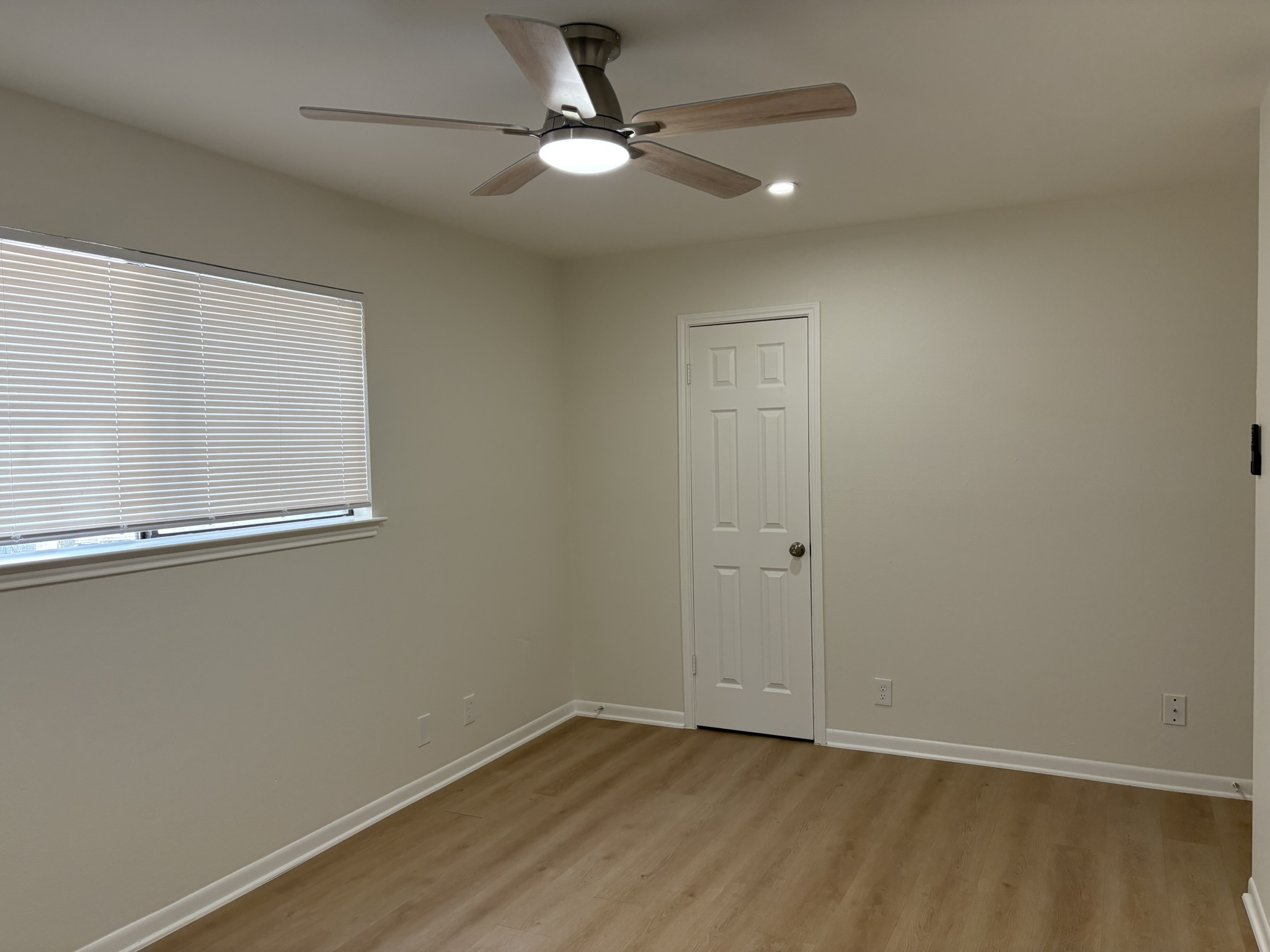 6009 Shadow Valley Cove, Unit A Austin, TX 78731 - Photo 17 of 24 Unfurnished room with ceiling fan, light wood-style floors, and recessed lighting