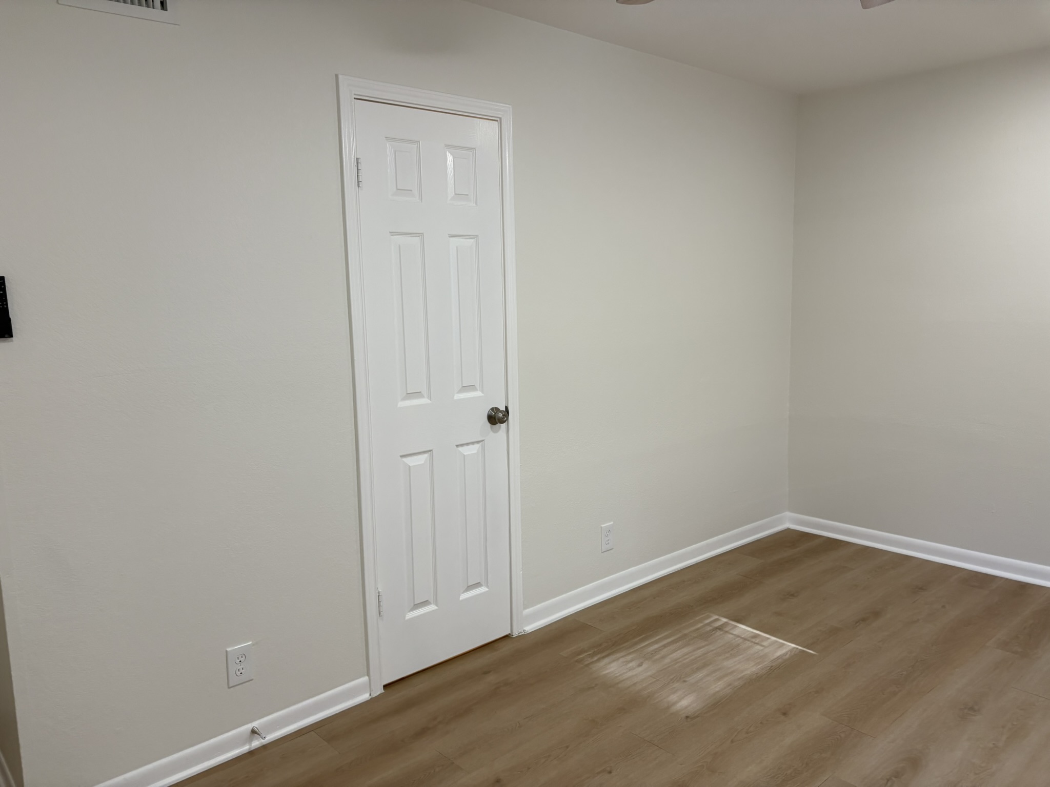 6009 Shadow Valley Cove, Unit A Austin, TX 78731 - Photo 19 of 24 Unfurnished room featuring wood finished floors and a ceiling fan