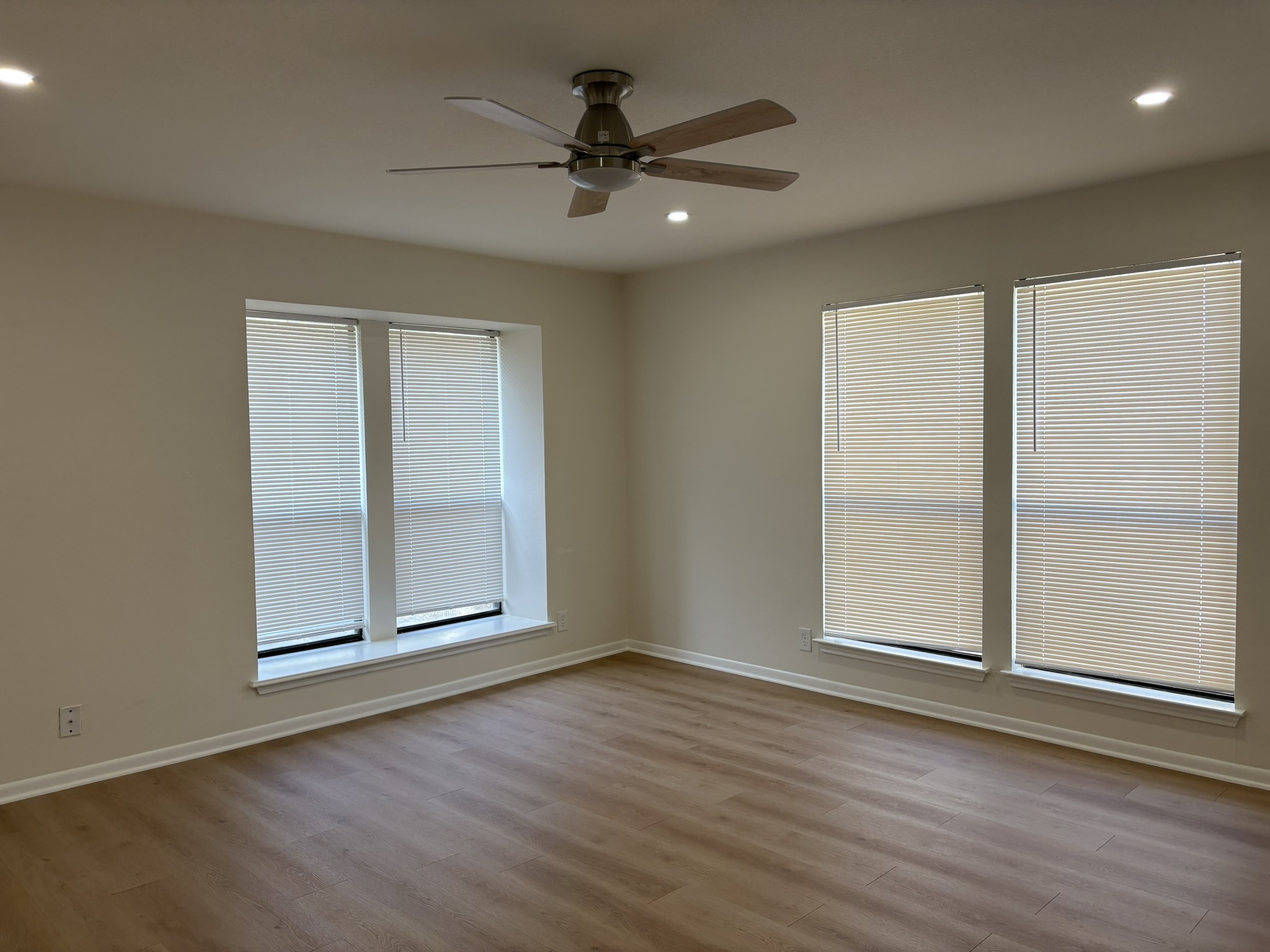 6009 Shadow Valley Cove, Unit A Austin, TX 78731 - Photo 4 of 24 Spare room with light wood finished floors, recessed lighting, healthy amount of natural light, and a ceiling fan