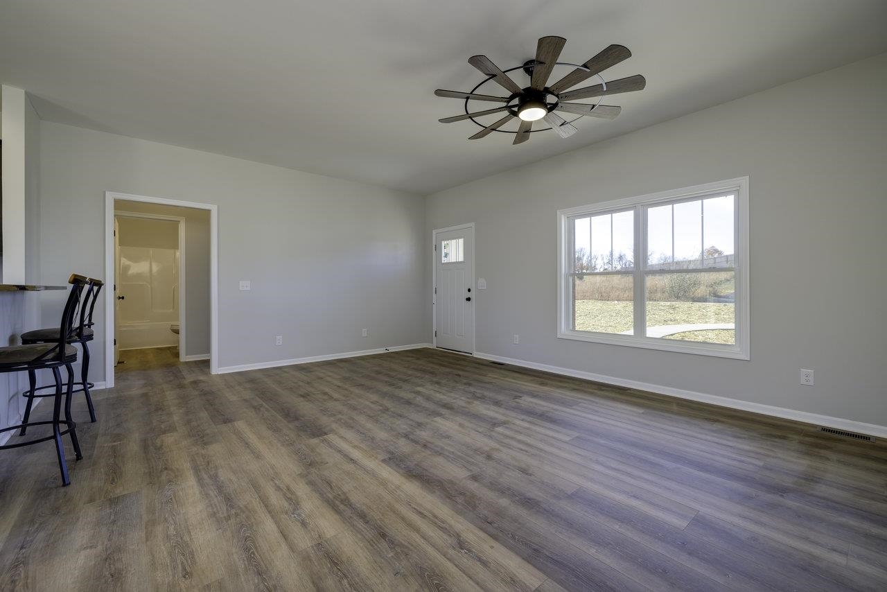 105 Springridge Lane Fairfield, VA 24435 - Photo 20 of 54 a view of an empty room with a window and wooden floor