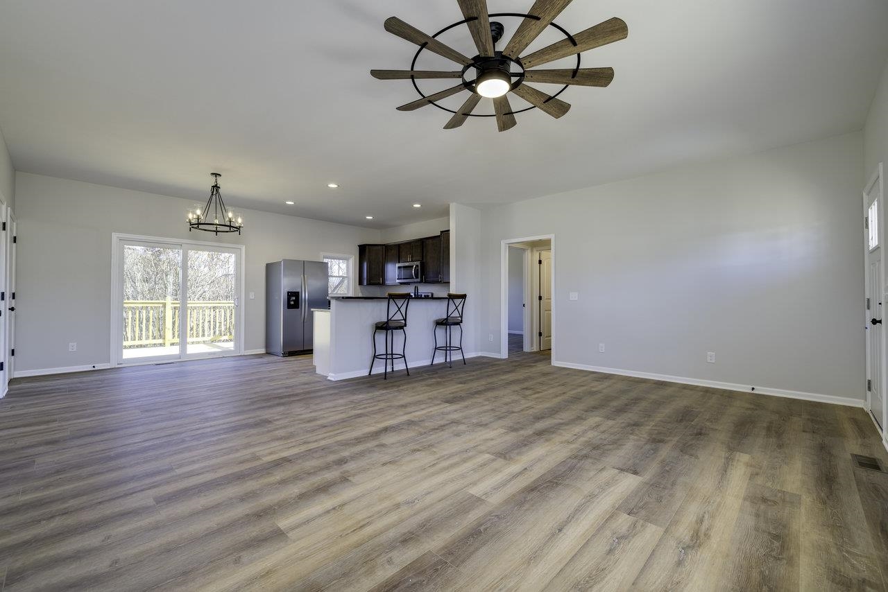 105 Springridge Lane Fairfield, VA 24435 - Photo 21 of 54 a view of empty room with wooden floor and ceiling fan
