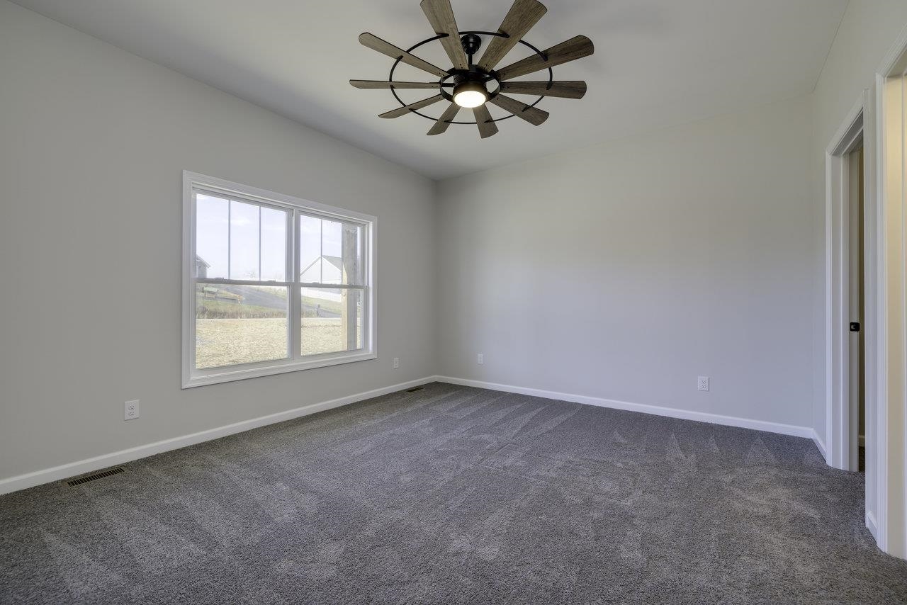 105 Springridge Lane Fairfield, VA 24435 - Photo 27 of 54 an empty room with a window and a fan