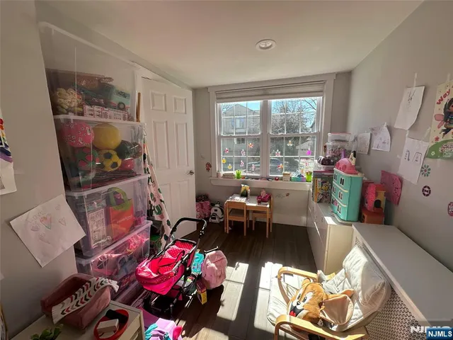 a living room with furniture a couch and a floor to ceiling window