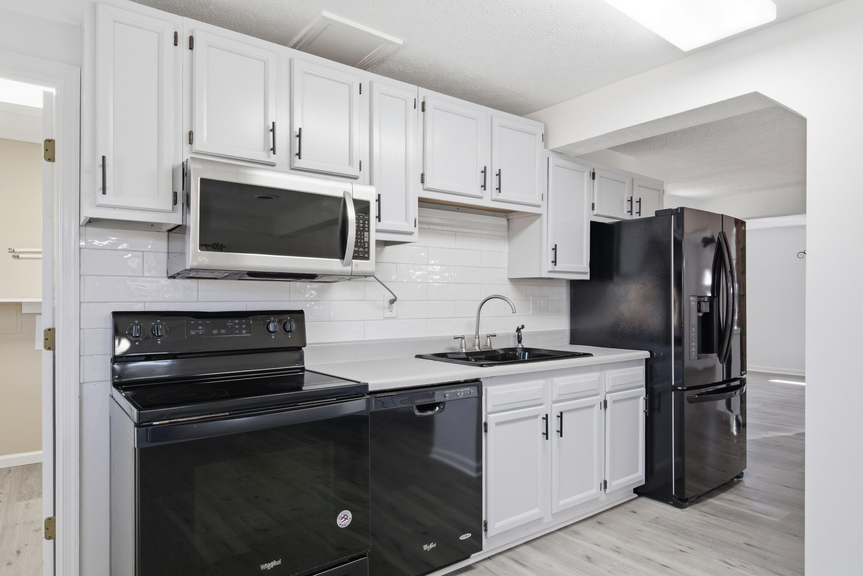 6458 Piney Woods Road Riner, VA 24149 - Photo 8 of 50 a kitchen with cabinets stainless steel appliances and a sink