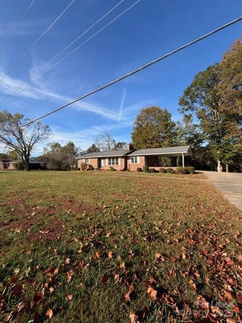 1972 Connelly Springs Road Lenoir, NC 28645 - Photo 1 of 13 a view of a house with a yard