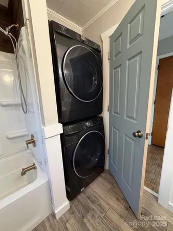 a view of a hallway with washer and dryer