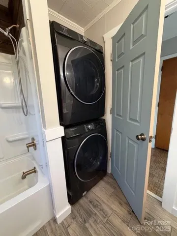 a view of a hallway with washer and dryer