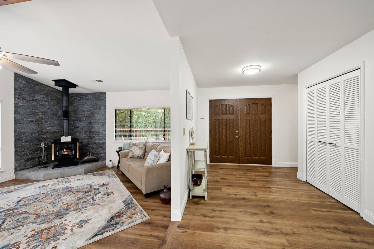 6561 Trinity Way Placerville, CA 95667 - Photo 37 of 58 a spacious bedroom with a bed and a couch