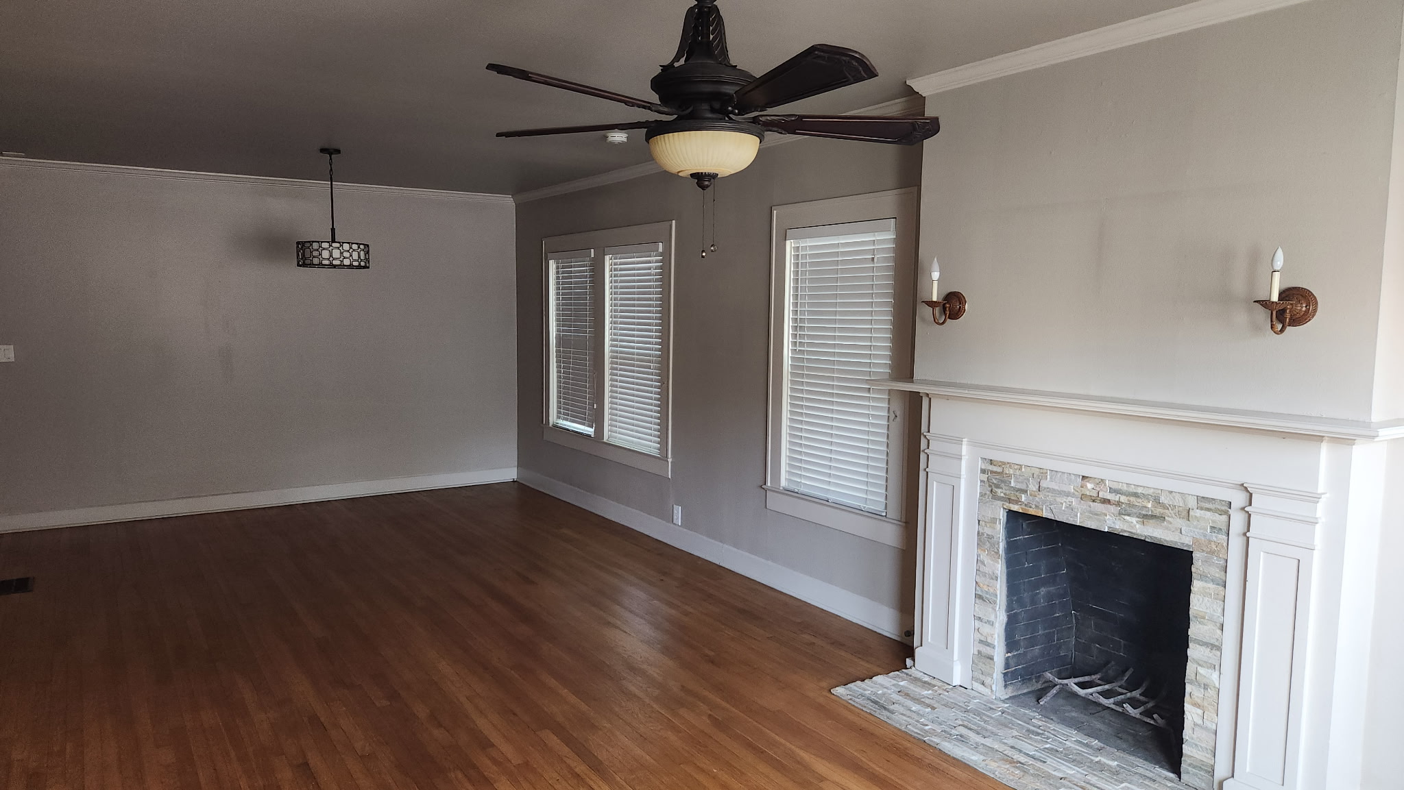 1709 Enfield Road, Unit A Austin, TX 78703 - Photo 2 of 8 Rich hardwood floors welcome you into this living area, highlighted by a stone-surround fireplace.