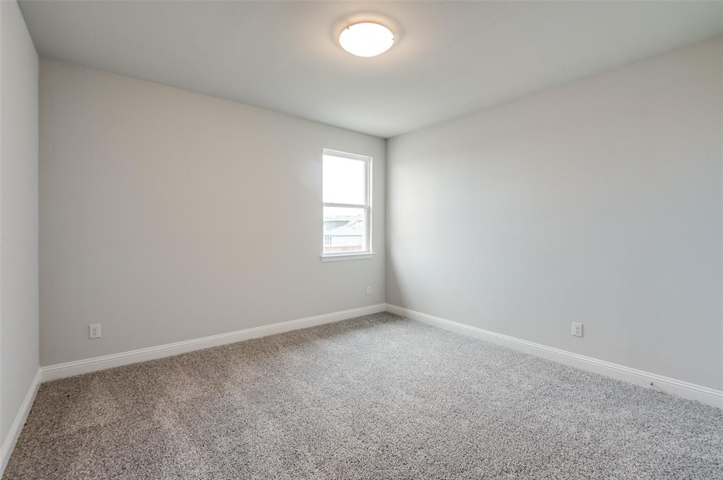 832 Santa Lucia Drive Anna, TX 75409 - Photo 13 of 33 Spare room featuring carpet flooring and baseboards