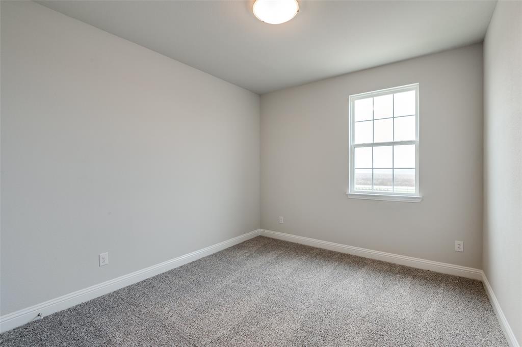 832 Santa Lucia Drive Anna, TX 75409 - Photo 15 of 33 Carpeted spare room with baseboards