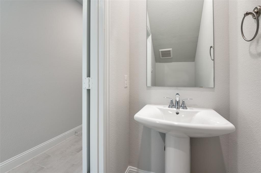 832 Santa Lucia Drive Anna, TX 75409 - Photo 17 of 33 Bathroom with baseboards and wood finished floors