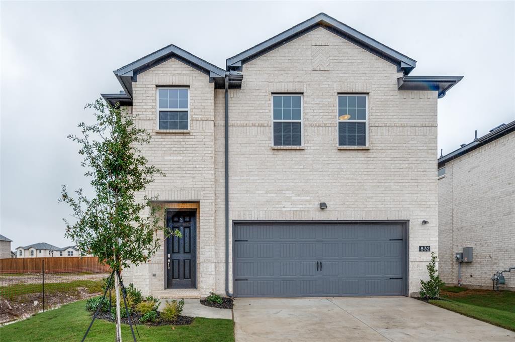 832 Santa Lucia Drive Anna, TX 75409 - Photo 2 of 33 View of front facade featuring a garage, brick siding, and driveway