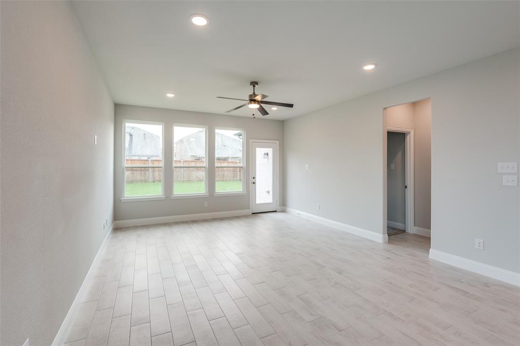 832 Santa Lucia Drive Anna, TX 75409 - Photo 8 of 33 Spare room featuring light wood finished floors, a ceiling fan, and recessed lighting