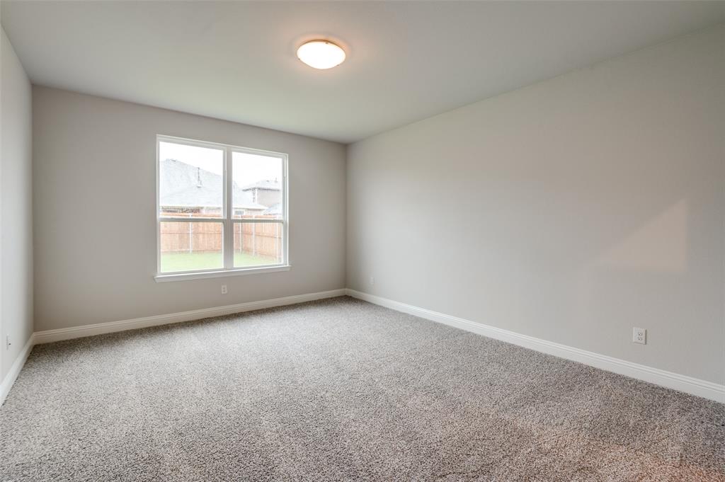 832 Santa Lucia Drive Anna, TX 75409 - Photo 9 of 33 Carpeted spare room with baseboards