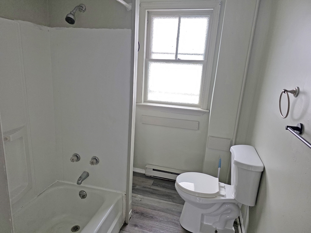 150 Forest Street Fall River, MA 02721 - Photo 8 of 9 a white toilet sitting next to a bath tub