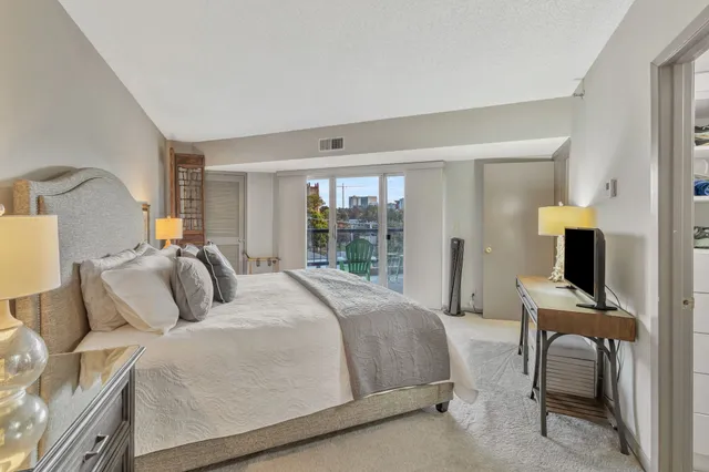 a bedroom with a bed and a desk