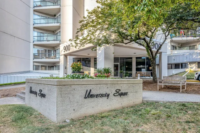 a front view of a building with outdoor seating