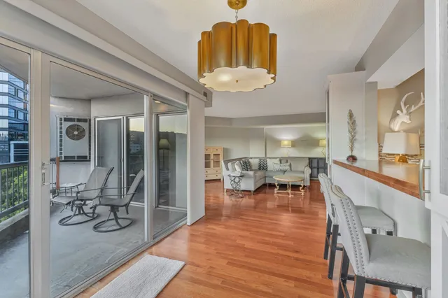 a very nice looking dining room with a large window and chairs