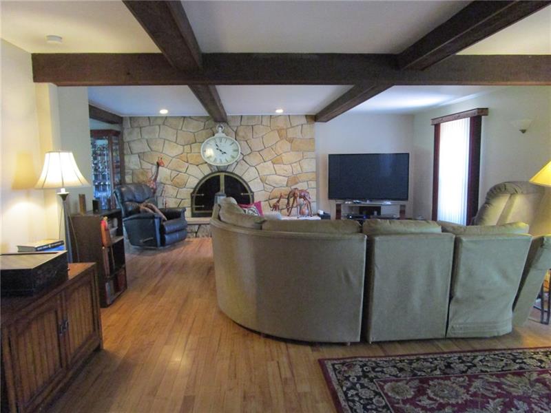 70 Spring Street Pittsburgh, PA 15223 - Photo 11 of 25 Living Room with Beautiful Stone Accent Wall