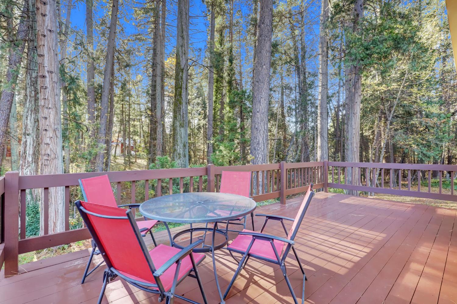 364 Gracie Road Nevada City, CA 95959 - Photo 17 of 59 a view of a chairs and table on the wooden floor