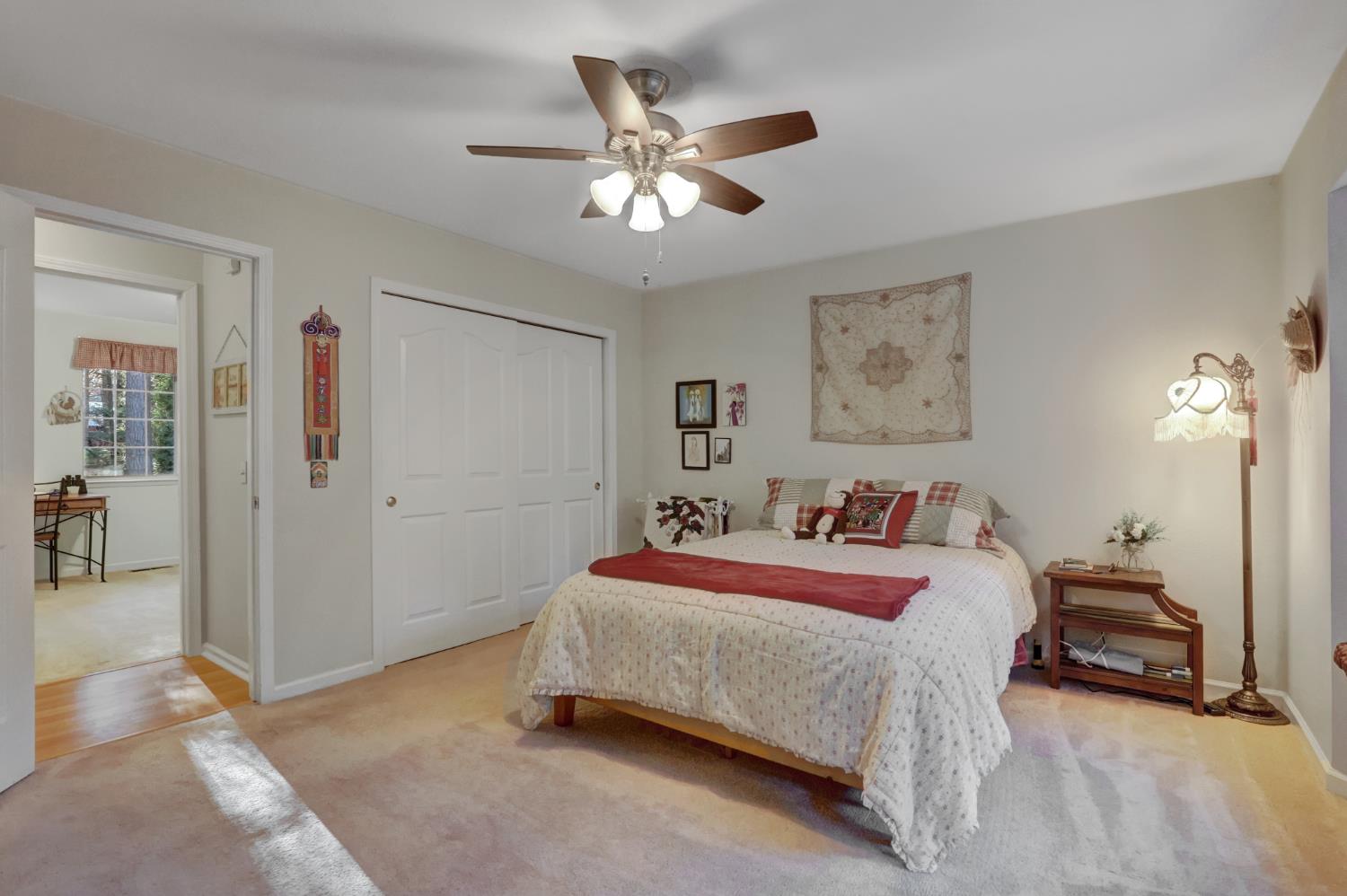 364 Gracie Road Nevada City, CA 95959 - Photo 24 of 59 a bedroom with a bed and a chandelier