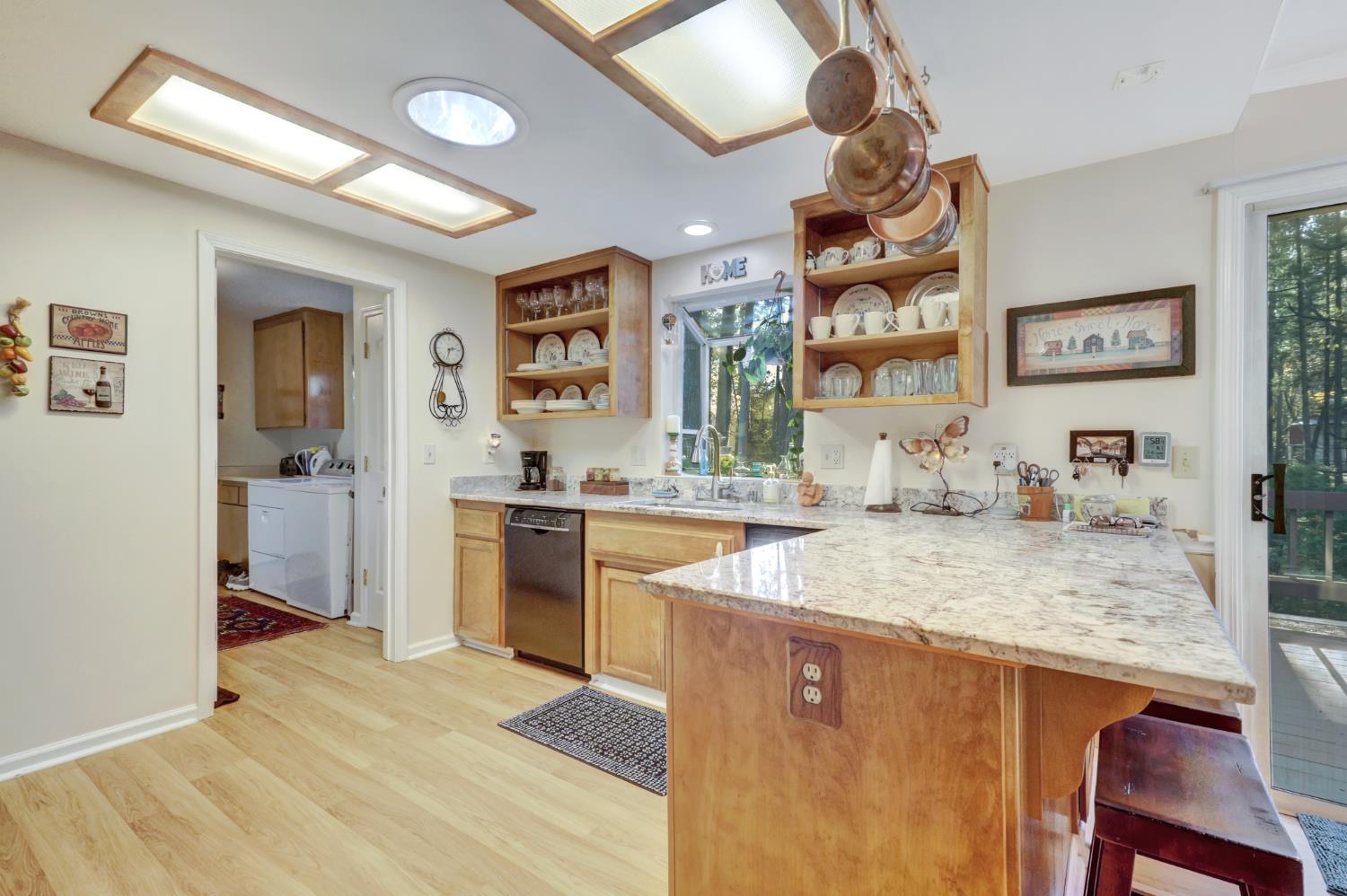 364 Gracie Road Nevada City, CA 95959 - Photo 44 of 59 a kitchen with stainless steel appliances granite countertop a sink stove and refrigerator