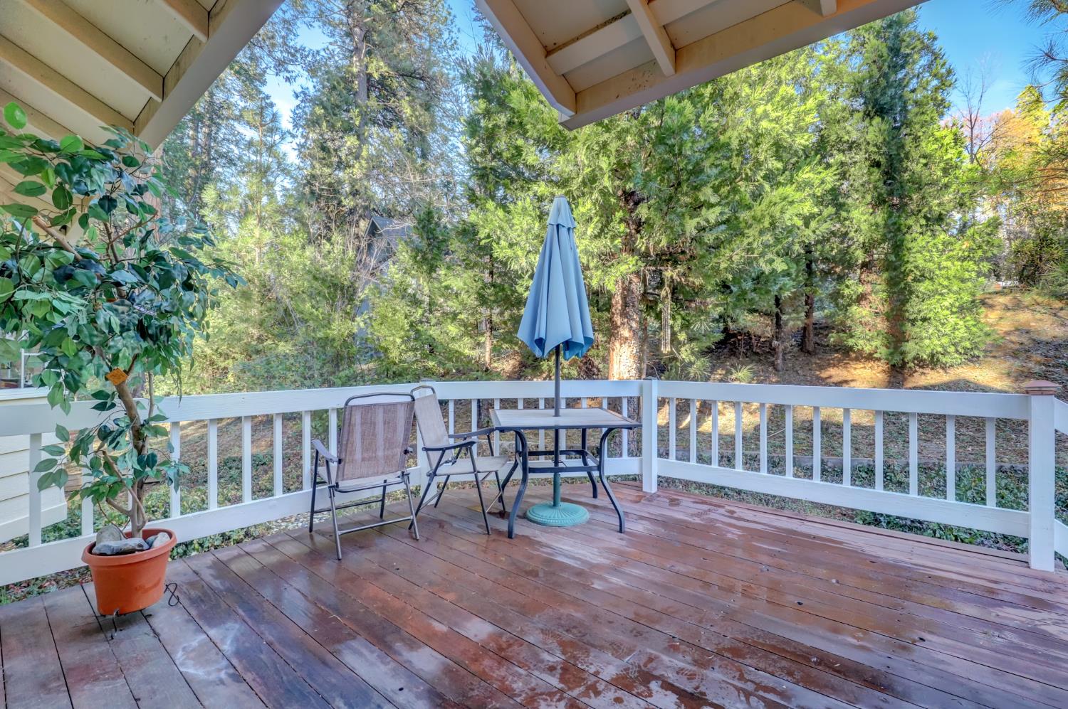 364 Gracie Road Nevada City, CA 95959 - Photo 7 of 59 a view of a chair and table on the wooden deck