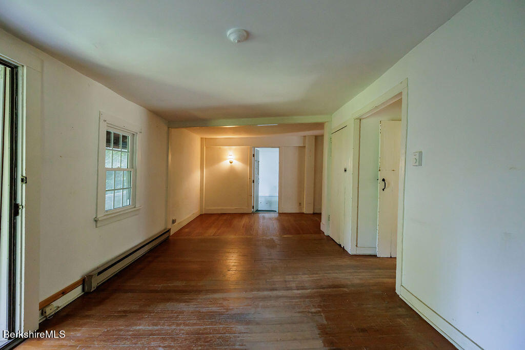 179 South Main Street Sheffield, MA 01257 - Photo 11 of 30 a view of empty room with wooden floor and fan