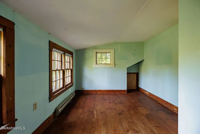 a bathroom with a sink mirror and toilet