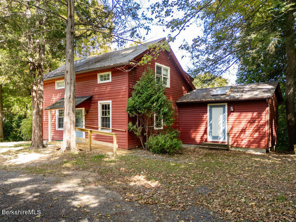 179 South Main Street Sheffield, MA 01257 - Photo 2 of 30 a front view of a house with a yard and garage