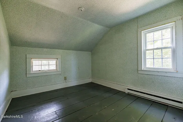 a view of a house with a large tree and a large tree