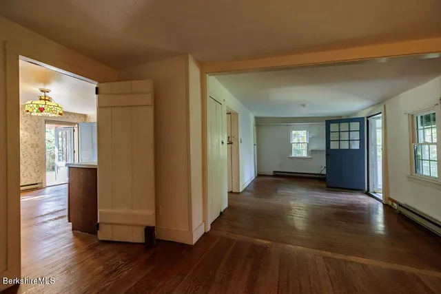 a wooden bench sitting in the middle of a forest