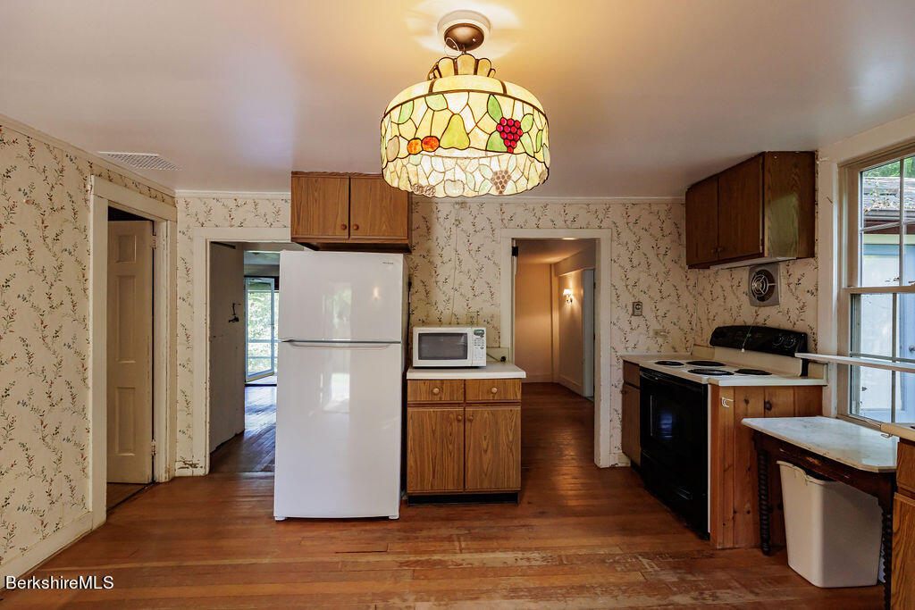 179 South Main Street Sheffield, MA 01257 - Photo 5 of 30 a kitchen with stainless steel appliances granite countertop a refrigerator a stove top oven a sink and dishwasher