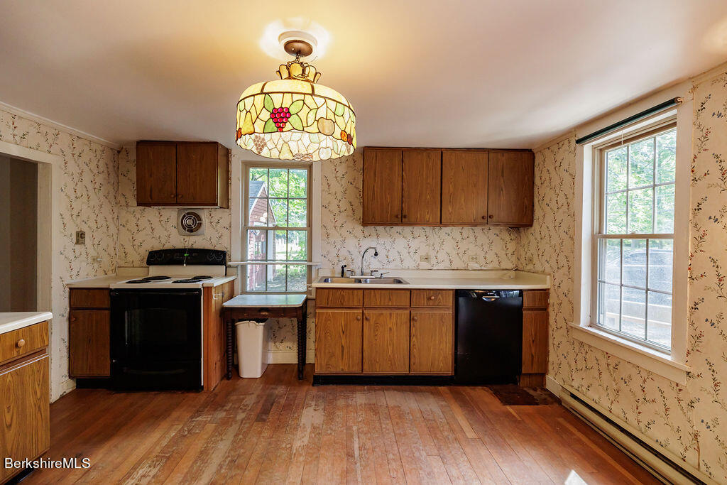 179 South Main Street Sheffield, MA 01257 - Photo 6 of 30 a kitchen with stainless steel appliances granite countertop a stove and a wooden cabinets