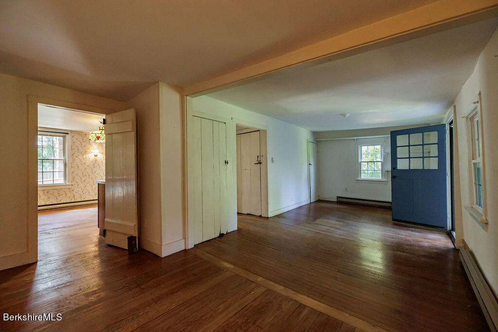 179 South Main Street Sheffield, MA 01257 - Photo 9 of 30 an empty room with wooden floor and windows